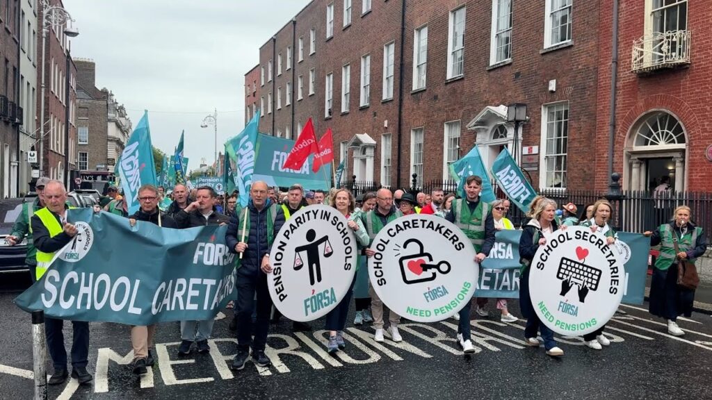 School secretaries and caretakers hold demonstration after beginning indefinite strike action