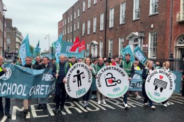 School secretaries and caretakers hold demonstration after beginning indefinite strike action