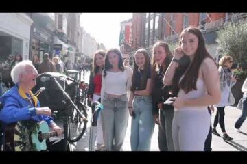 A Group of Dublin Girls stop to sing along with Legendary Busker Jimmy C