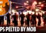 Riot cops pelted with bottles and stones as disorder broke out a Dublin asylum seekers hotel
