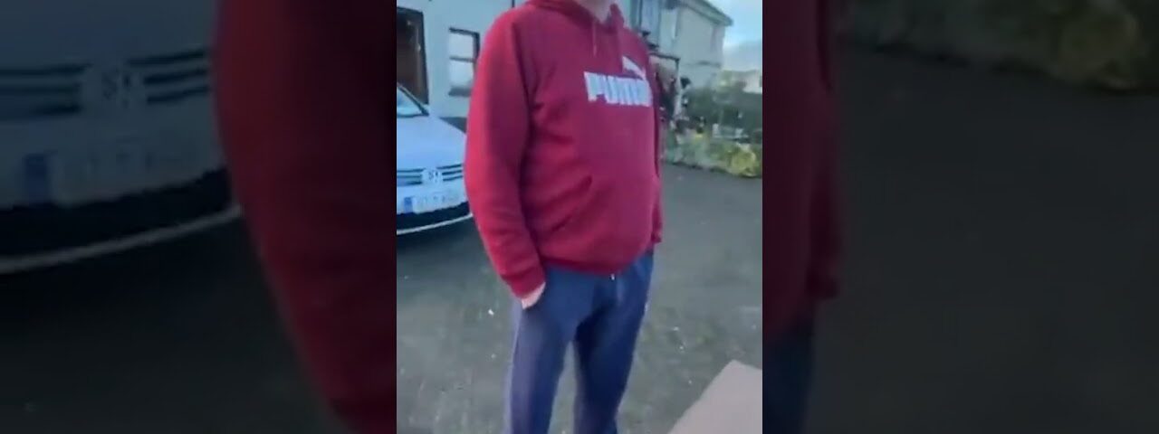Irishman putting up Irish flags gets threatened with a hurley!