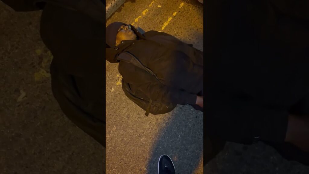 African migrant decides to lie in front of traffic on a main road. Tonlegee road, Dublin