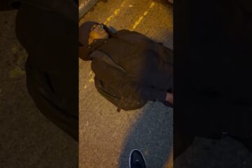 African migrant decides to lie in front of traffic on a main road. Tonlegee road, Dublin African migrant decides to lie in front of traffic on a main road. Tonlegee road, Dublin